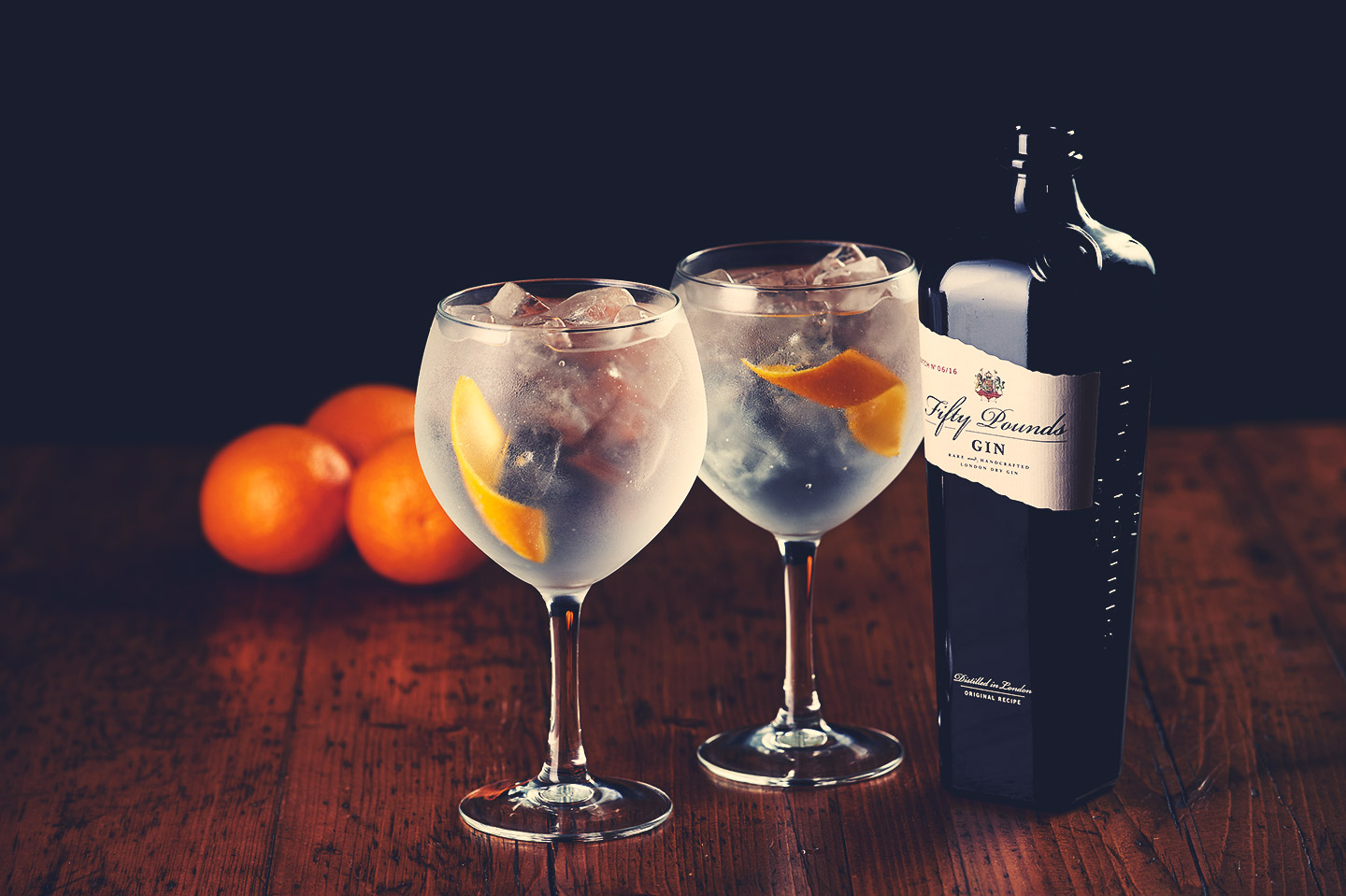 Gin & tonic with orange peel Fifty Pounds Fifty Pounds Gin.